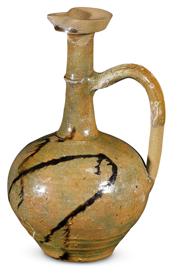 A glazed globular jar with a long, upright neck, a spout, and a handle, and painted with bold irregular lines.